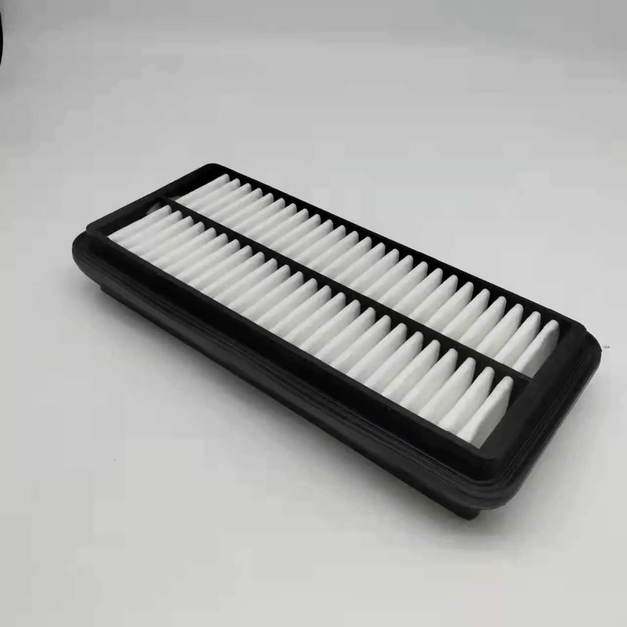 Black rectangular car panel air filter with dimensions 256mm by 113mm by 40mm