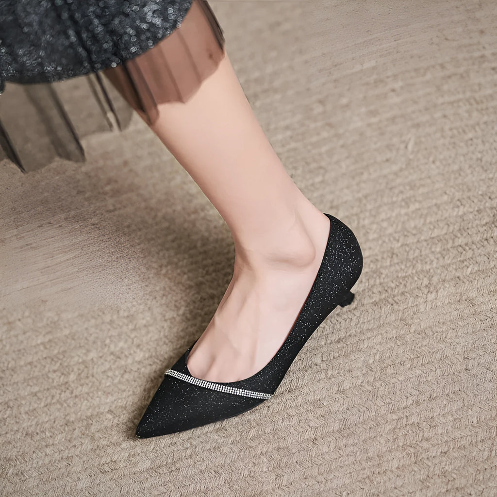 Black sequined women's high heel pumps with a 7cm stiletto heel and low upper.