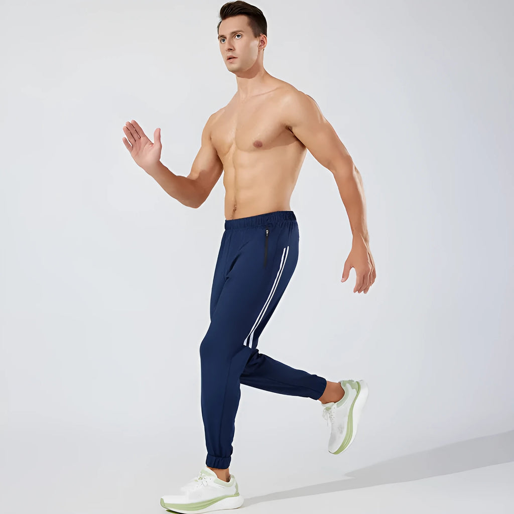 Black and navy blue men's polyester running trousers with mid-waist and long leg