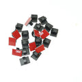 Black and white self-adhesive plastic buckles for organising flat car wiring cables