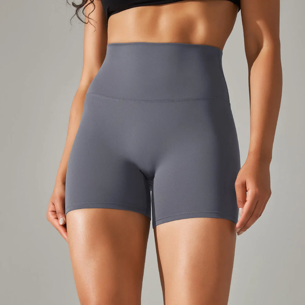 Women's high waist hip lift fitness pants in dark green with moisture-wicking fabric for sports activities