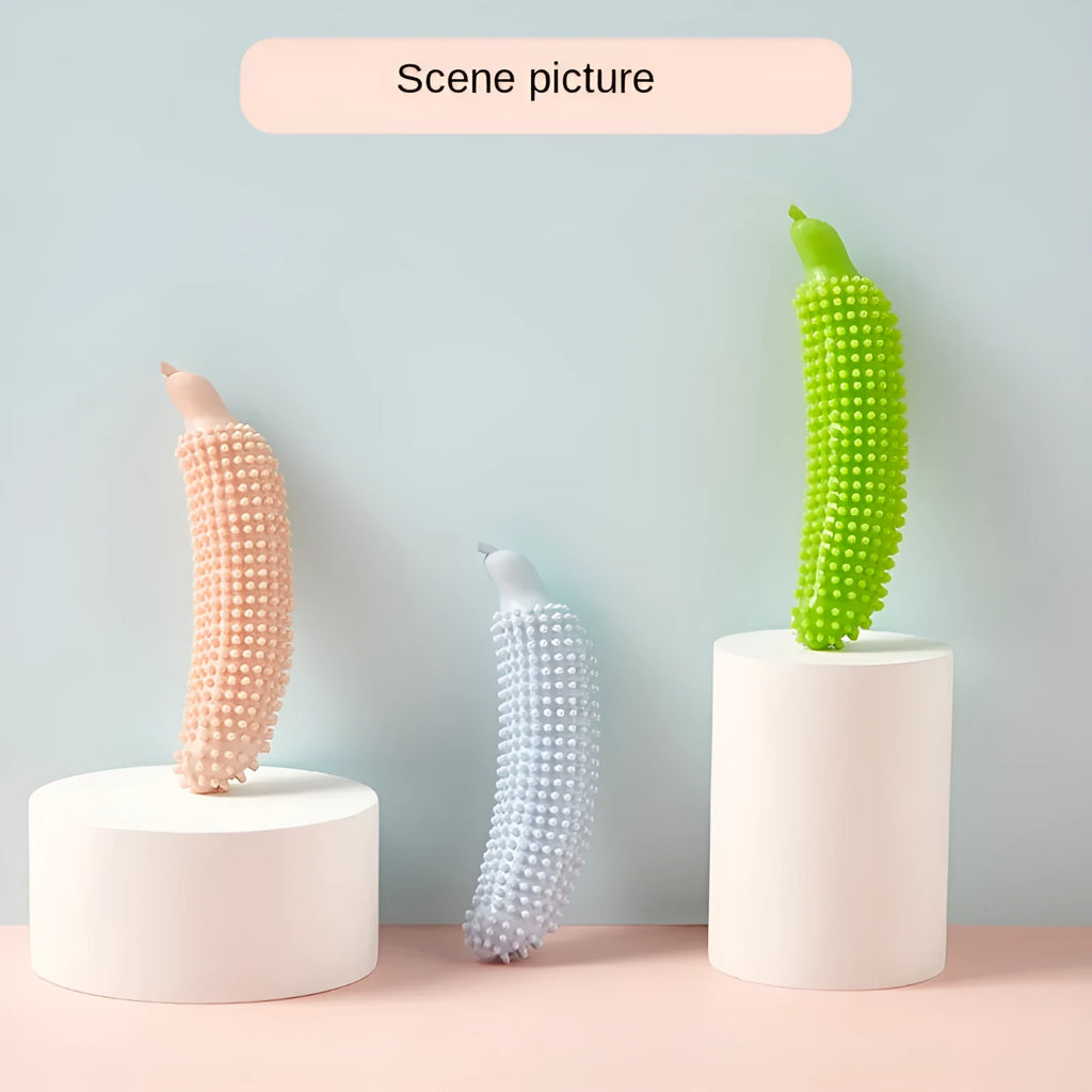 Green cucumber-shaped dog chew toy for teething and bite training on a white background.