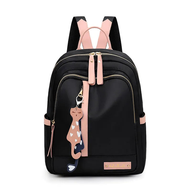 Black and pink women's casual nylon backpack showing soft surface and shoulder straps
