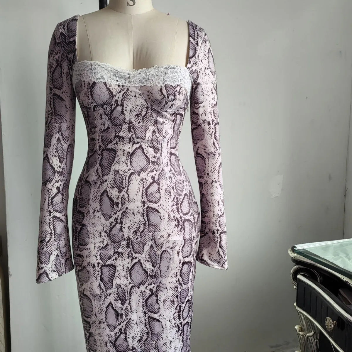 Grey slim-fit A-line lace dress with long sleeves and a digital 3D print pattern.