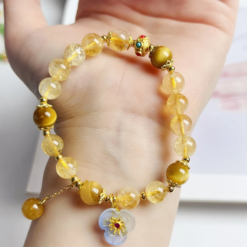 Women's citrine-coloured crystal bracelet with handcrafted flower tassel design