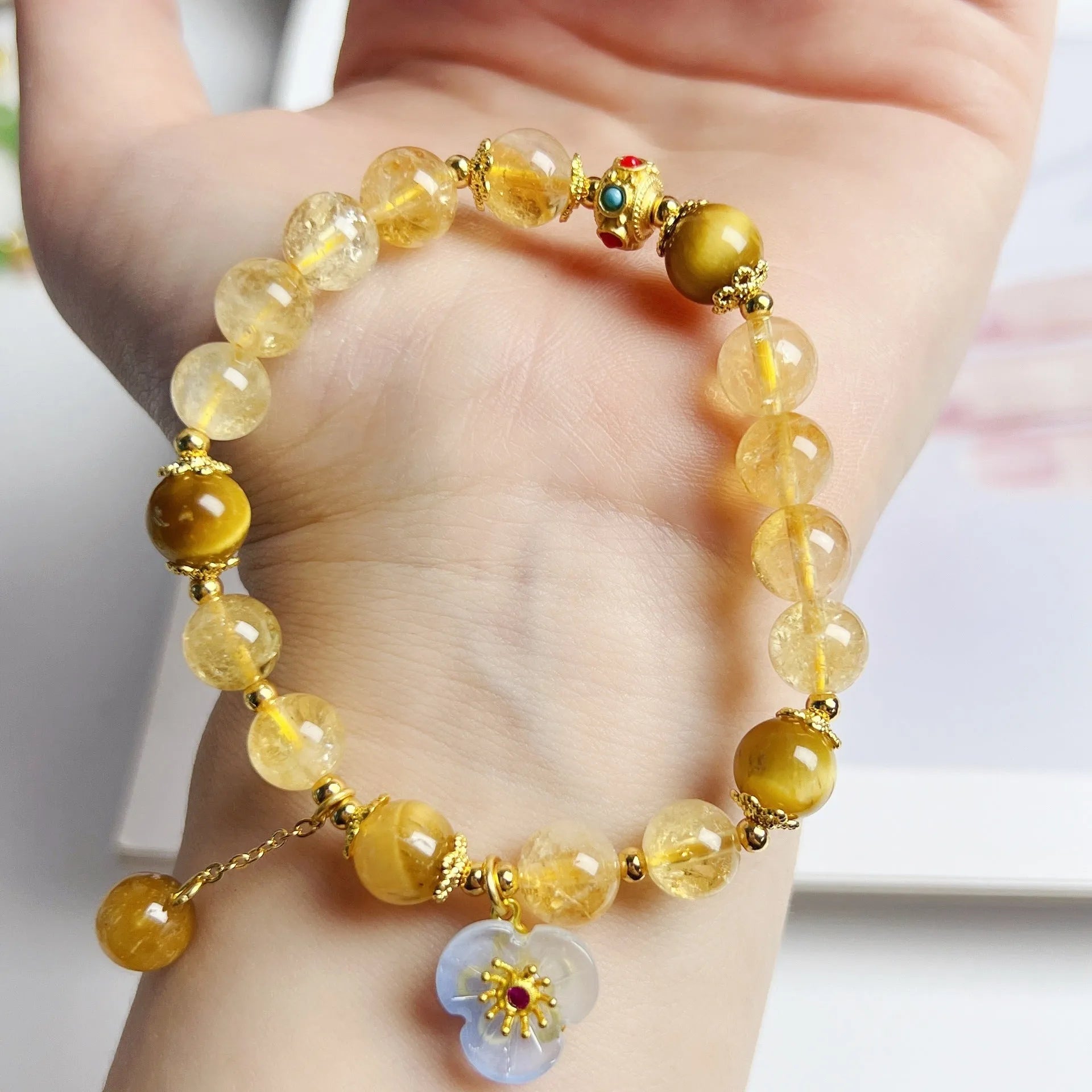 Women's citrine-coloured crystal bracelet with handcrafted flower tassel design