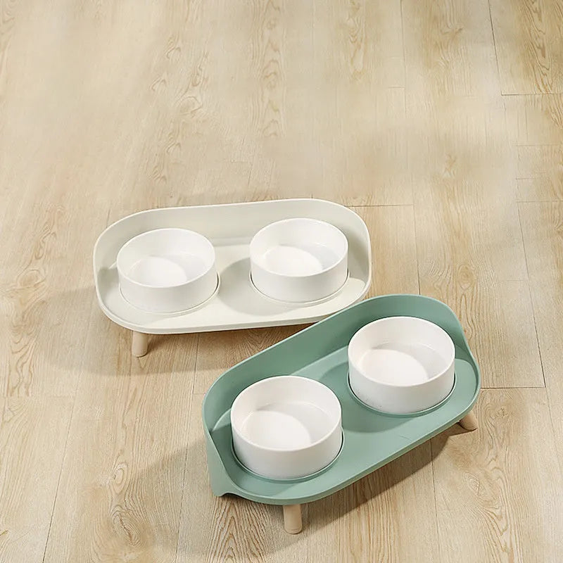 Green adjustable tilted double pet food bowl with spill-proof edges for cat and dog feeding