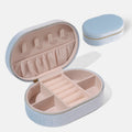 Oval velvet jewellery storage box in lake blue with flannel interior and removable hook.