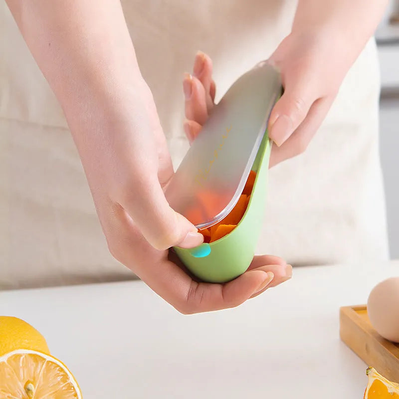 Dark green peeling knife with a storage tube and stainless steel blade on a kitchen worktop.