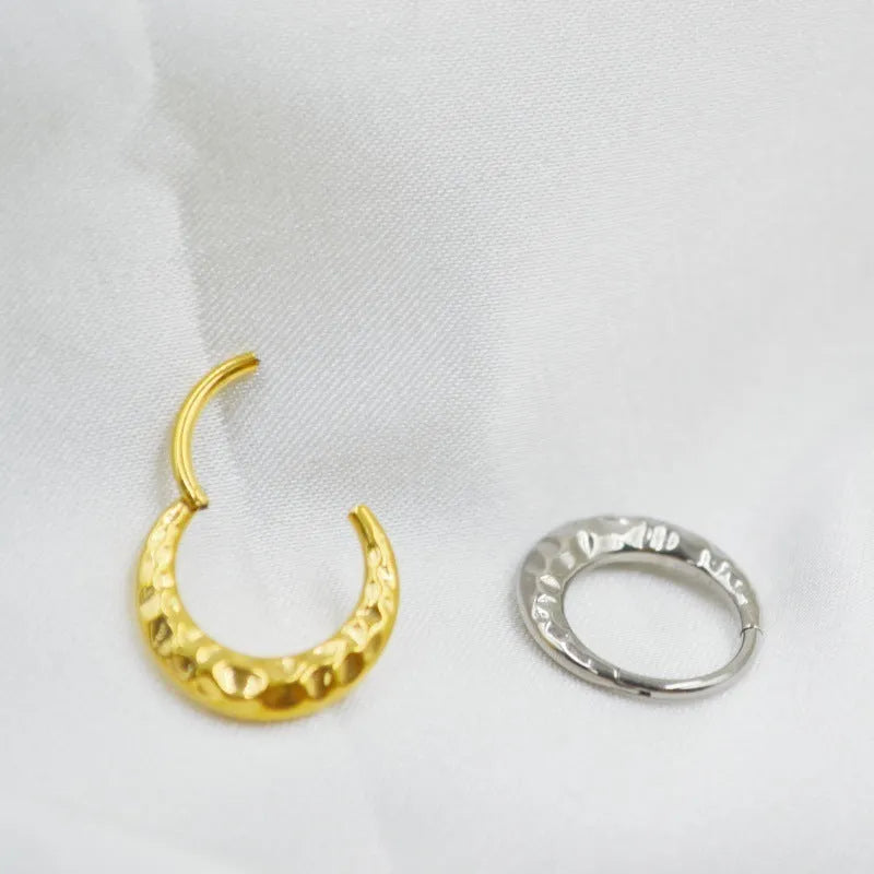 Titanium alloy ASTM F136 concave-convex nose ring in gold and silver colour options showing textured surface detail