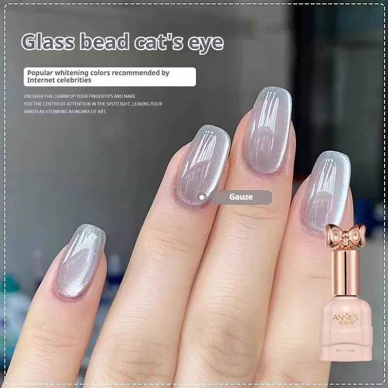 Micro glass bead cat's eye gel nail polish bottle showing cat's eye visual effect