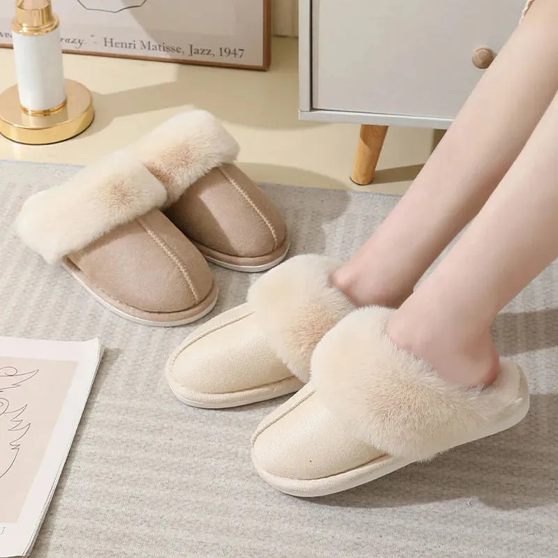 Women's plush winter slippers with artificial wool lining and a PVC sole in multiple colours.