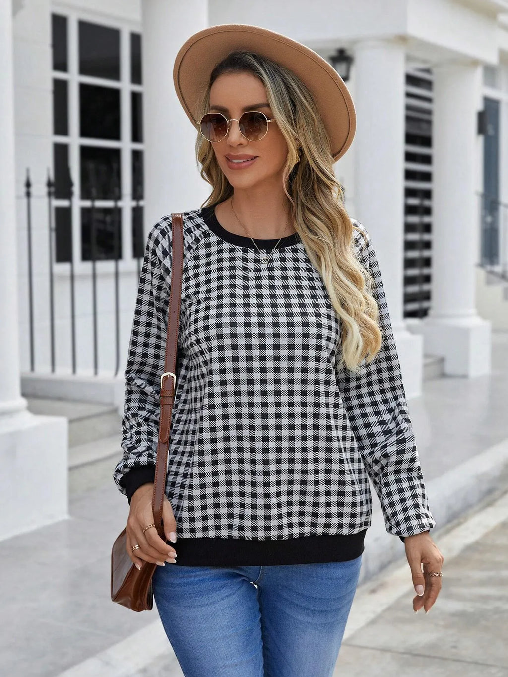 Black polyester pullover sweater with printed plaid and stripe pattern, long sleeves