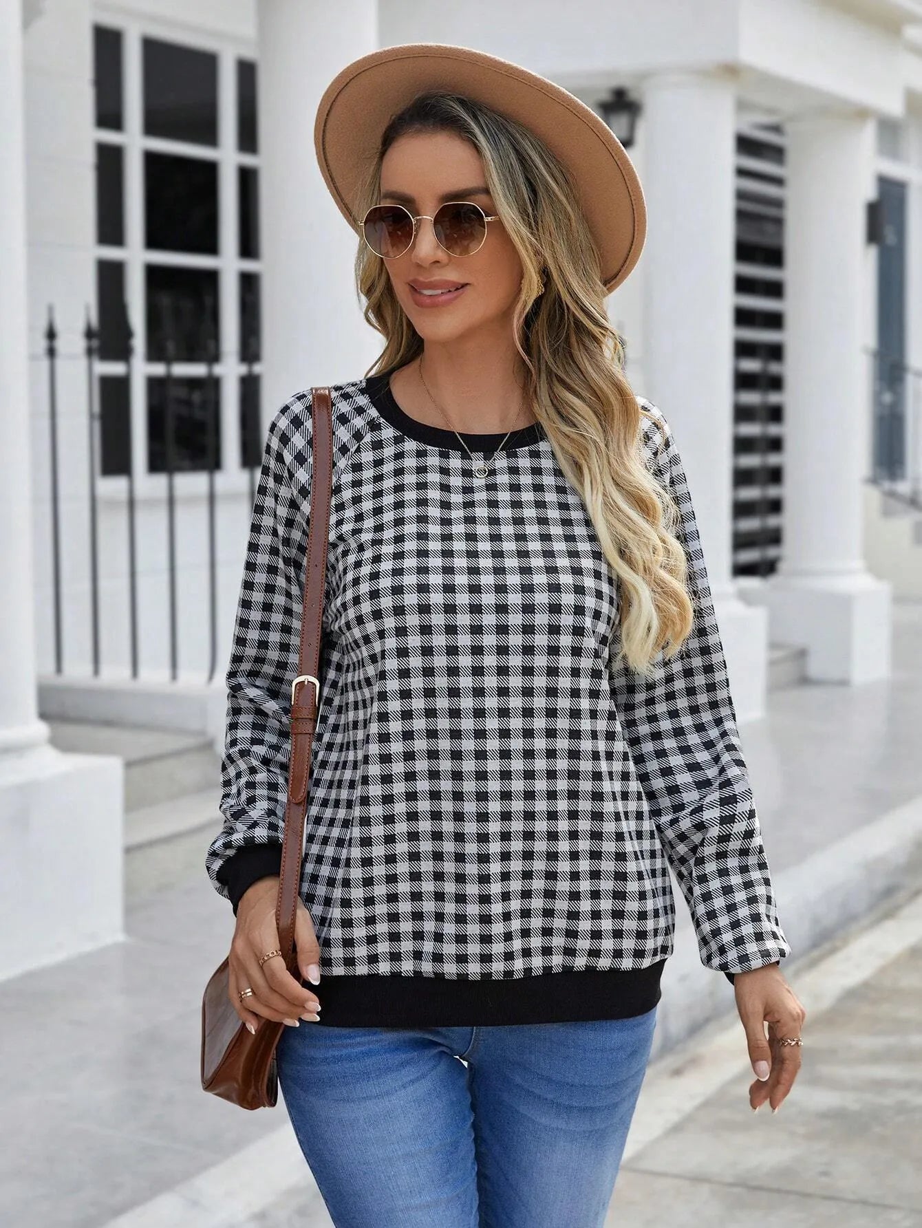 Black polyester pullover sweater with printed plaid and stripe pattern, long sleeves