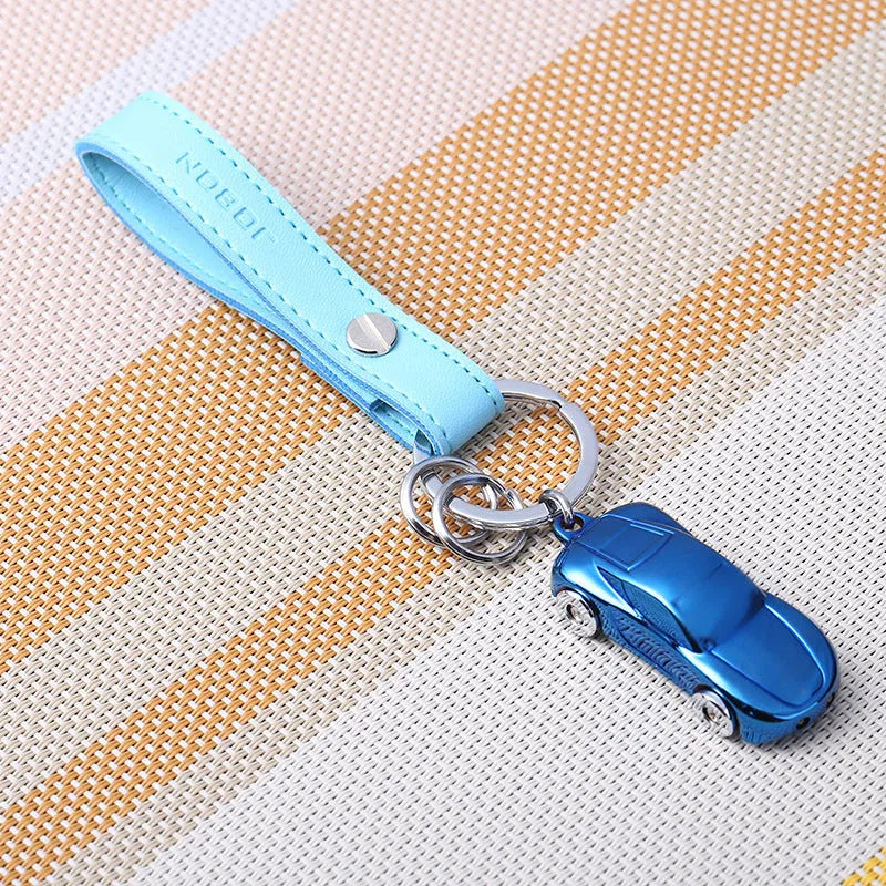 Close-up of a heart-shaped zinc alloy metal keychain pendant on a key ring, showing colour options.