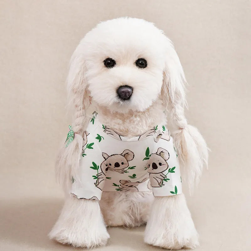 Colourful printed polyester t-shirt on a small dog, showing the casual fit and design.