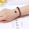 Double-layer women's bracelet with crystal beads and lucky charms in gold electroplated finish