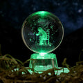 Transparent luminous crystal ball ornament with inner carvings on fixed base for desktop decoration