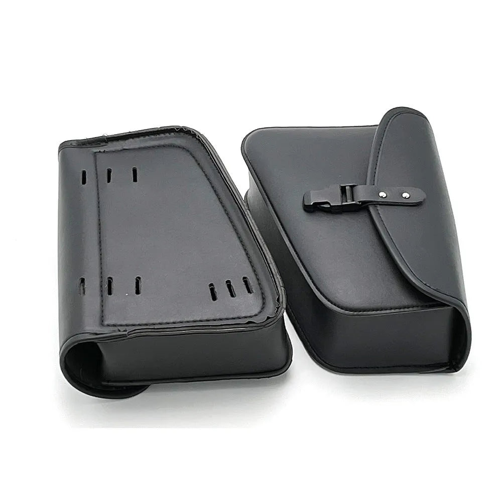 Black motorcycle swingarm saddlebag mounted on a Sportster, showing its size and side-mounting position.