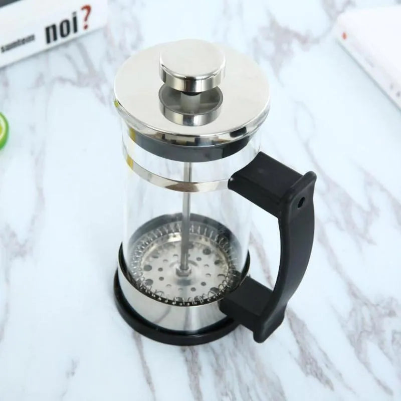 Compact glass pour-over coffee maker with stainless steel filter, 350ml capacity, 10cm wide.