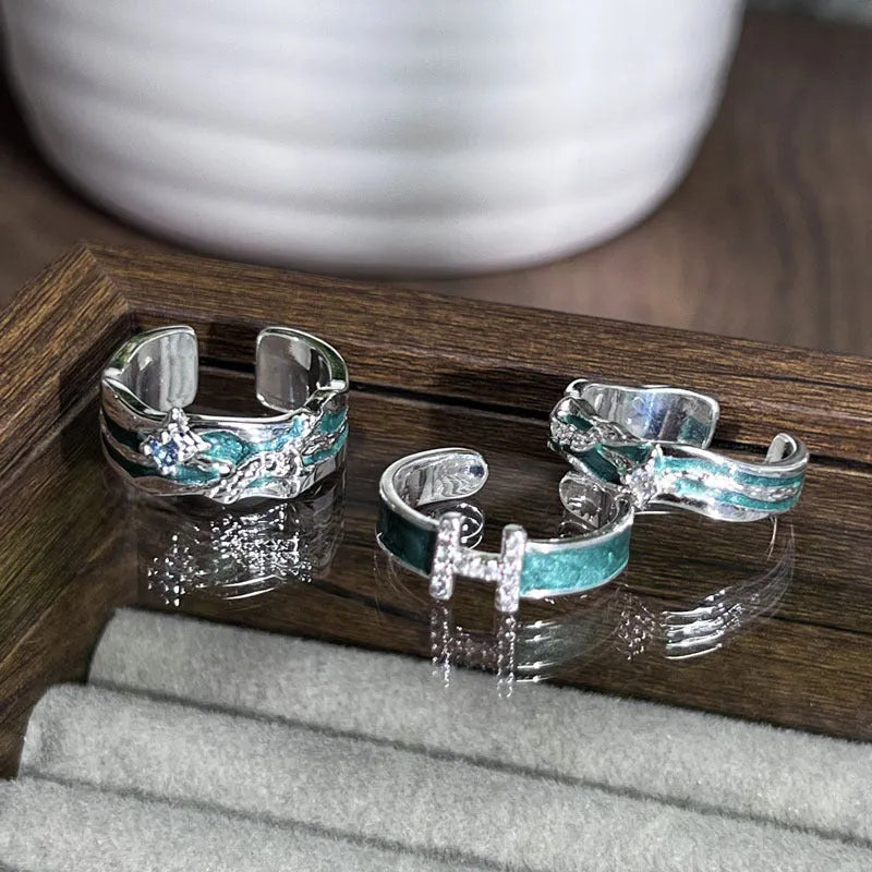 Mint green enamel asterism ring with copper construction and eight-awm star design