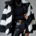 Women's faux fur coat with contrast colour lapel and matching fur collar on a model.