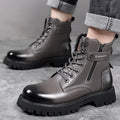 Men's light brown leather high-top boots with side zipper and thick rubber sole.