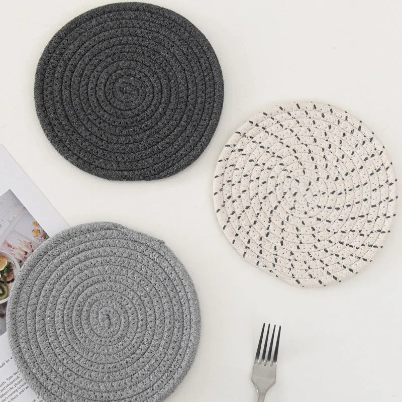 Three round 18cm cotton cord coaster placemats in modern minimalist design
