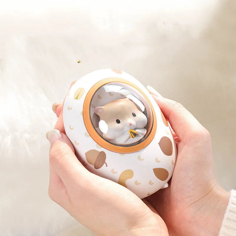 White Hamster hand warmer power bank with space capsule design showing charging port and heating controls