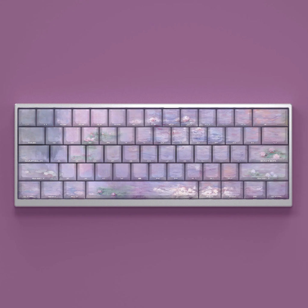 Set of white PBT keycaps with colourful water lily design on top and sides, showing side-engraved transparent characters.