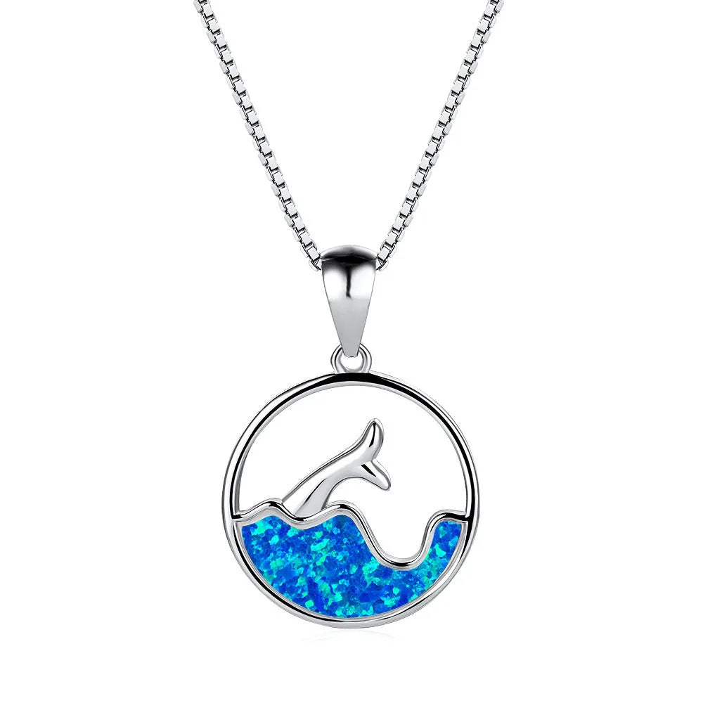 Geometric fishtail pendant necklace with round elements in platinum blue opal colour