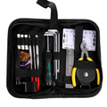 Black guitar repair tool kit open to show tools, next to an acoustic guitar.
