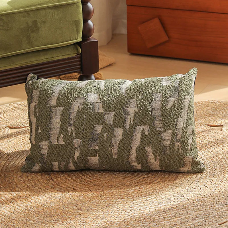 Close-up of a square Jacquard woven cushion cover with a detailed retro floral pattern in various colours.