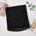 Thin black mesh belly band for waist trimming and postpartum tummy support laid flat.