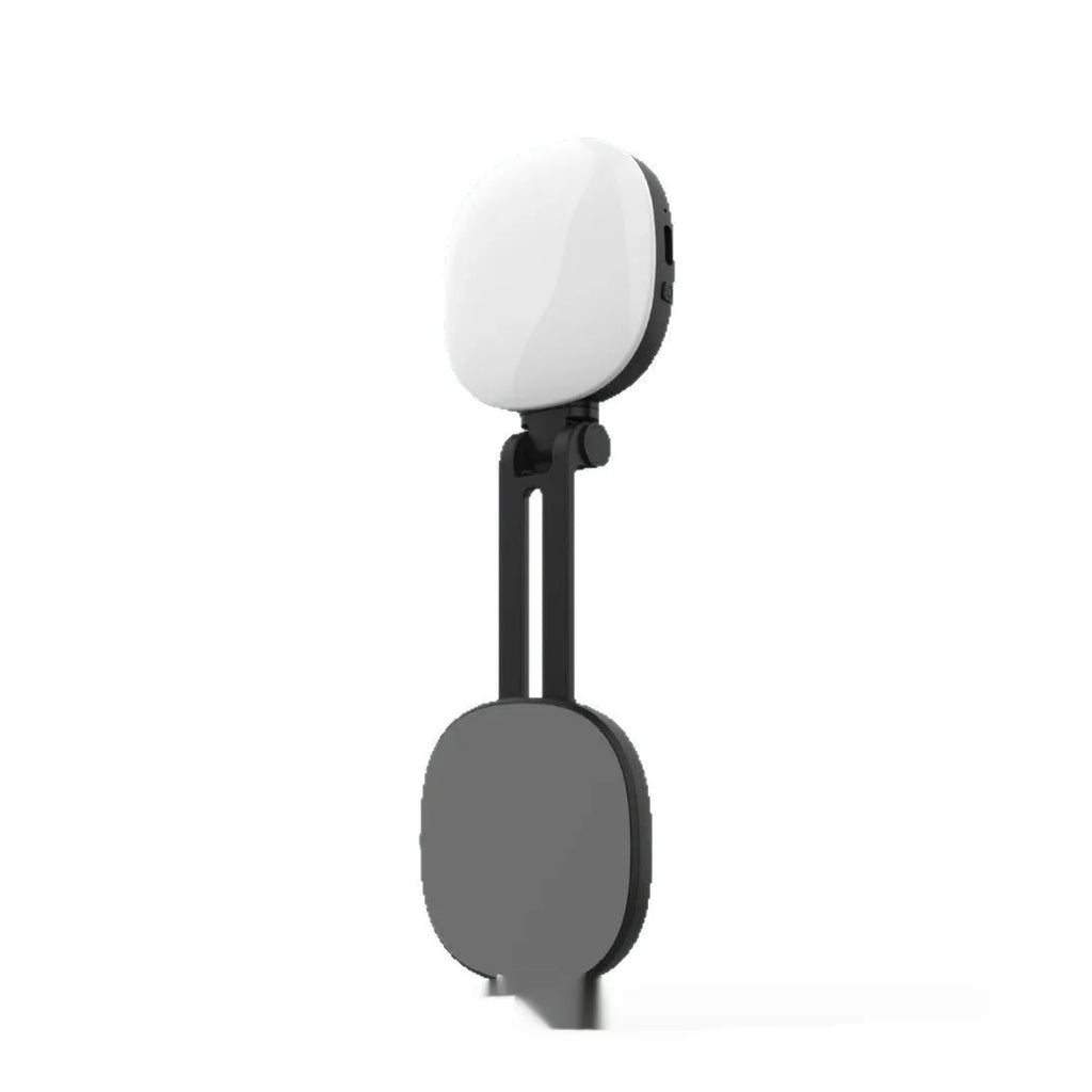 Black and white mini portable fill light with magnetic phone holder, showing three colour temperature buttons and a dimming slider.