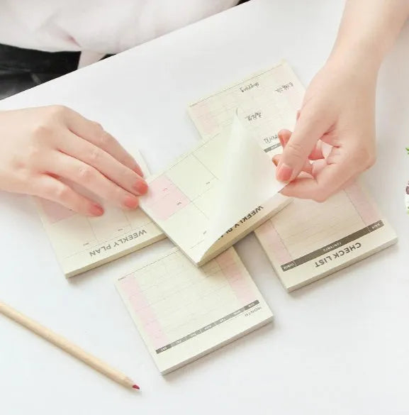 Small 9.5cm square paper planner with 60 sheets, available in monthly, weekly, or work planner style