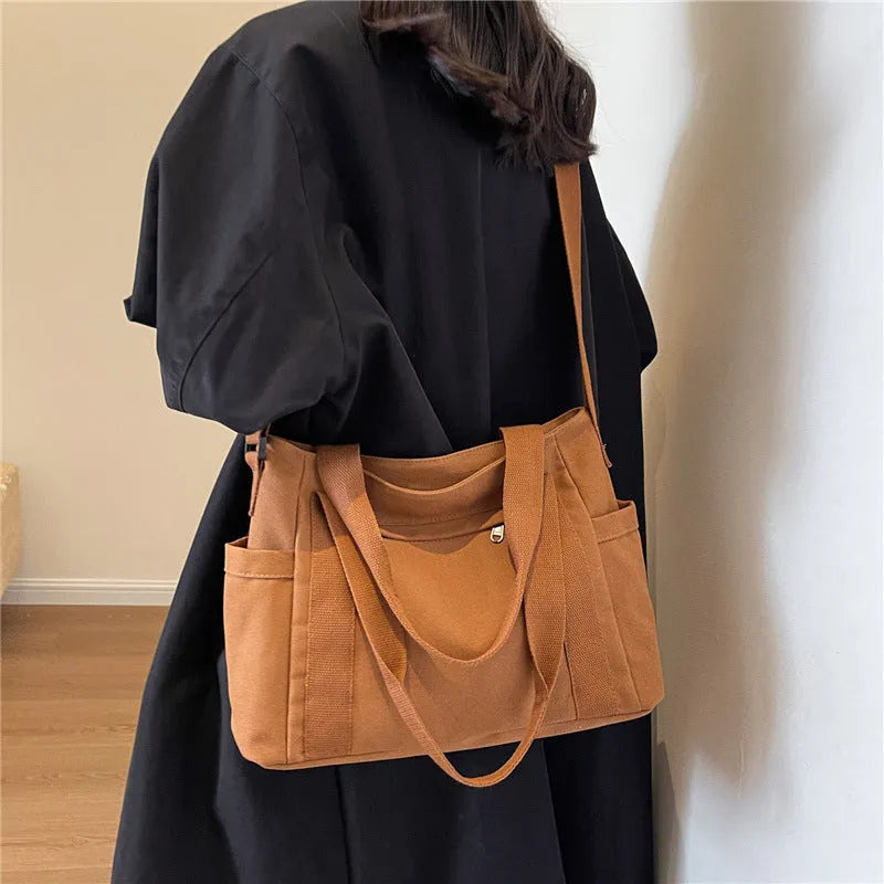 Large capacity canvas shoulder bag with sandwich pocket design in solid colour options