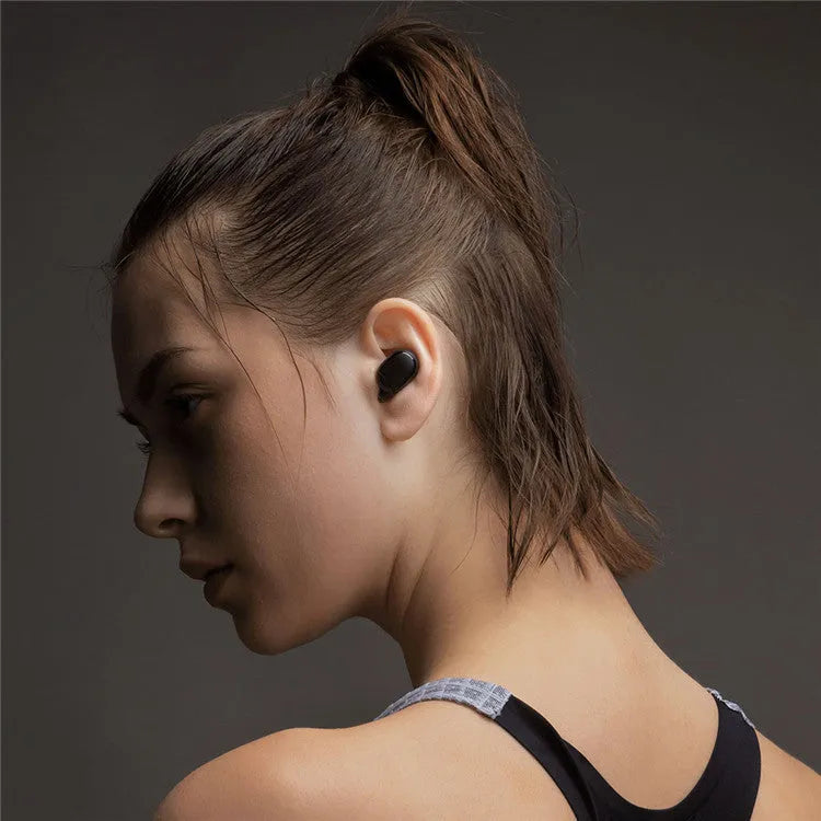 Redmi AirDots black true wireless Bluetooth headphones and charging case.