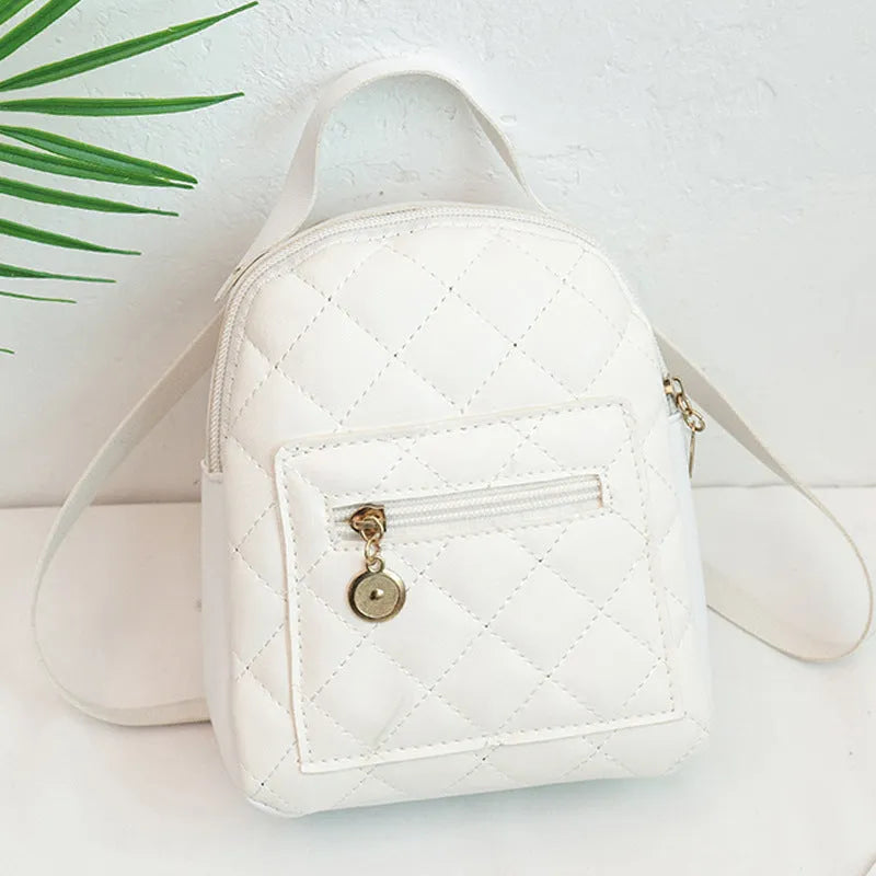 Hard square vertical girls' backpack in PU with embroidery, showing front sandwich pocket and soft carry handle.