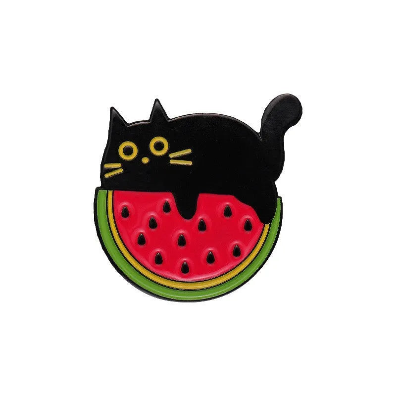 Colourful cartoon fruit and letter design on a metal brooch pin with a secure clasp.