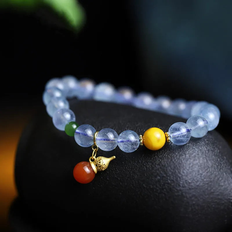 Women's bracelet with an 8mm geometric aquamarine crystal in an iced colour on a band.