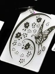 Plastic folding cake decorating mould showing windmill and five-pointed star design options