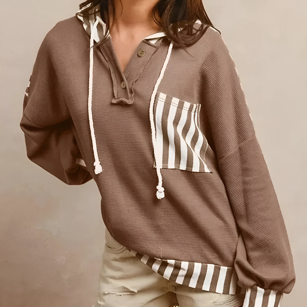 Straw yellow waffle texture hoodie with striped patchwork and a button neck.
