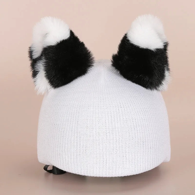 Plush fabric ski helmet decoration cover in a colourful cartoon character style.