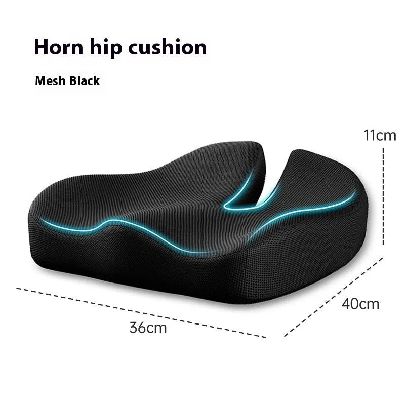 Black memory foam office chair cushion for waist support, shown on a desk chair.