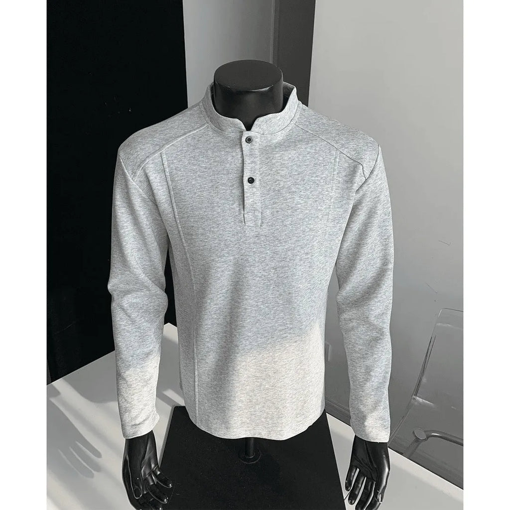 Men's loose-fitting asymmetric patchwork polo shirt with a stand-up collar and long sleeves in grey.