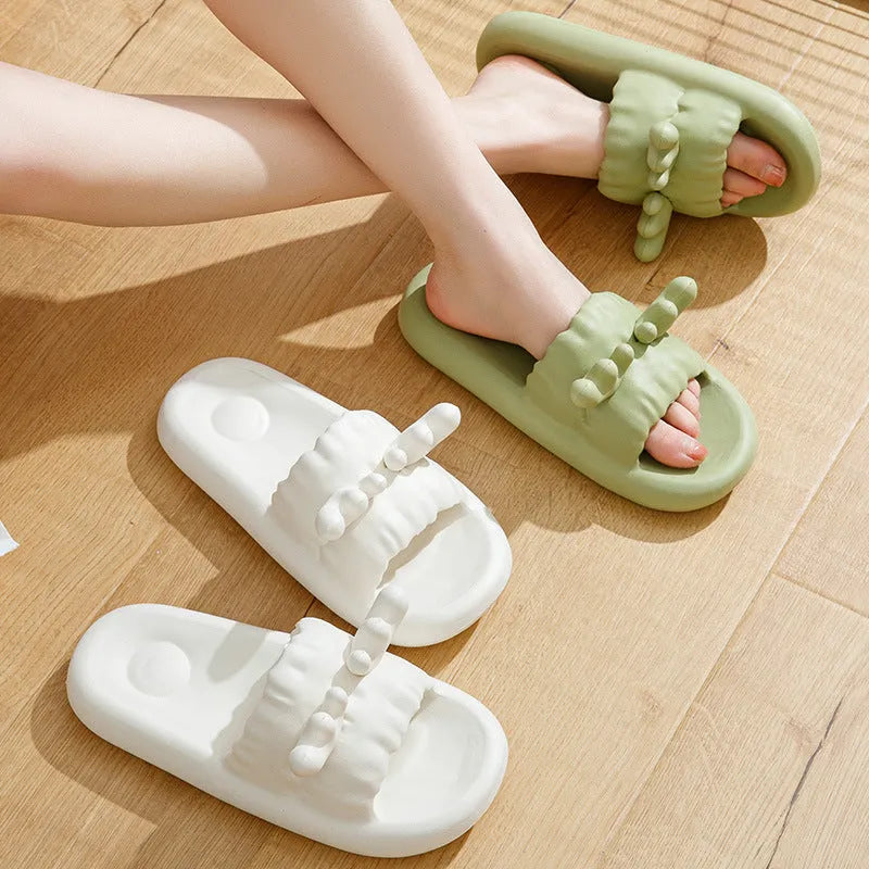 Deer horn design EVA flip flop slippers in light yellow on a white background.