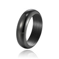 A glossy electroplated titanium steel ring shown in gold, black, and steel colour on a grey background.