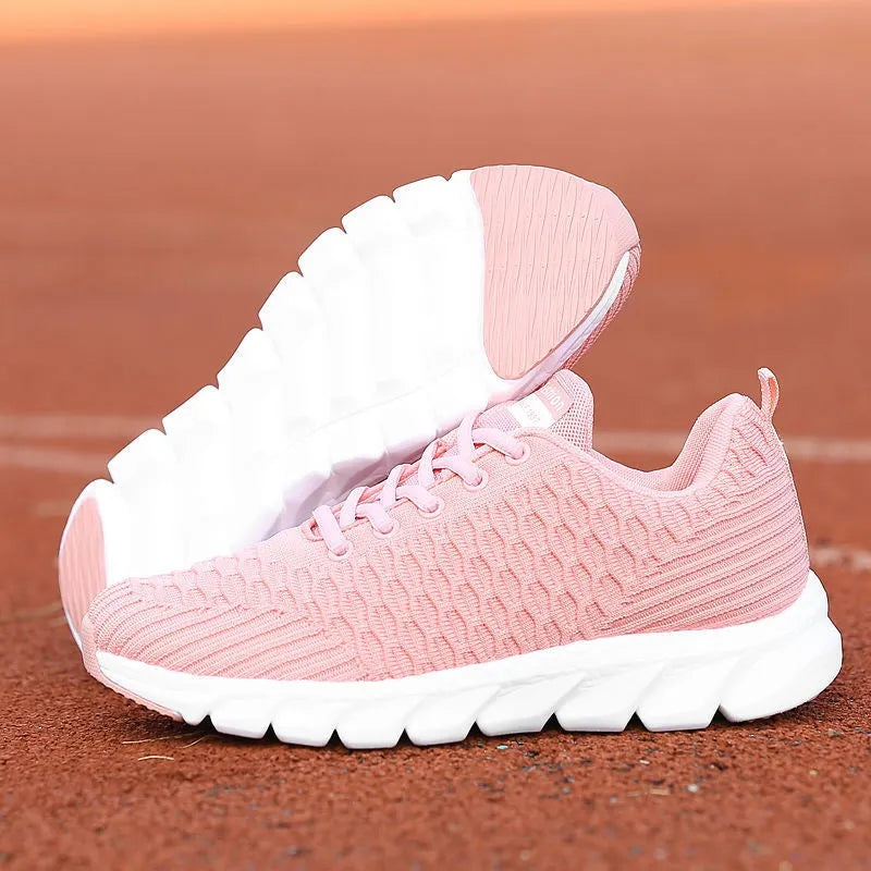 Women's running shoes with fly weaving upper in black, pink, or white colours showing wear-resistant outsole