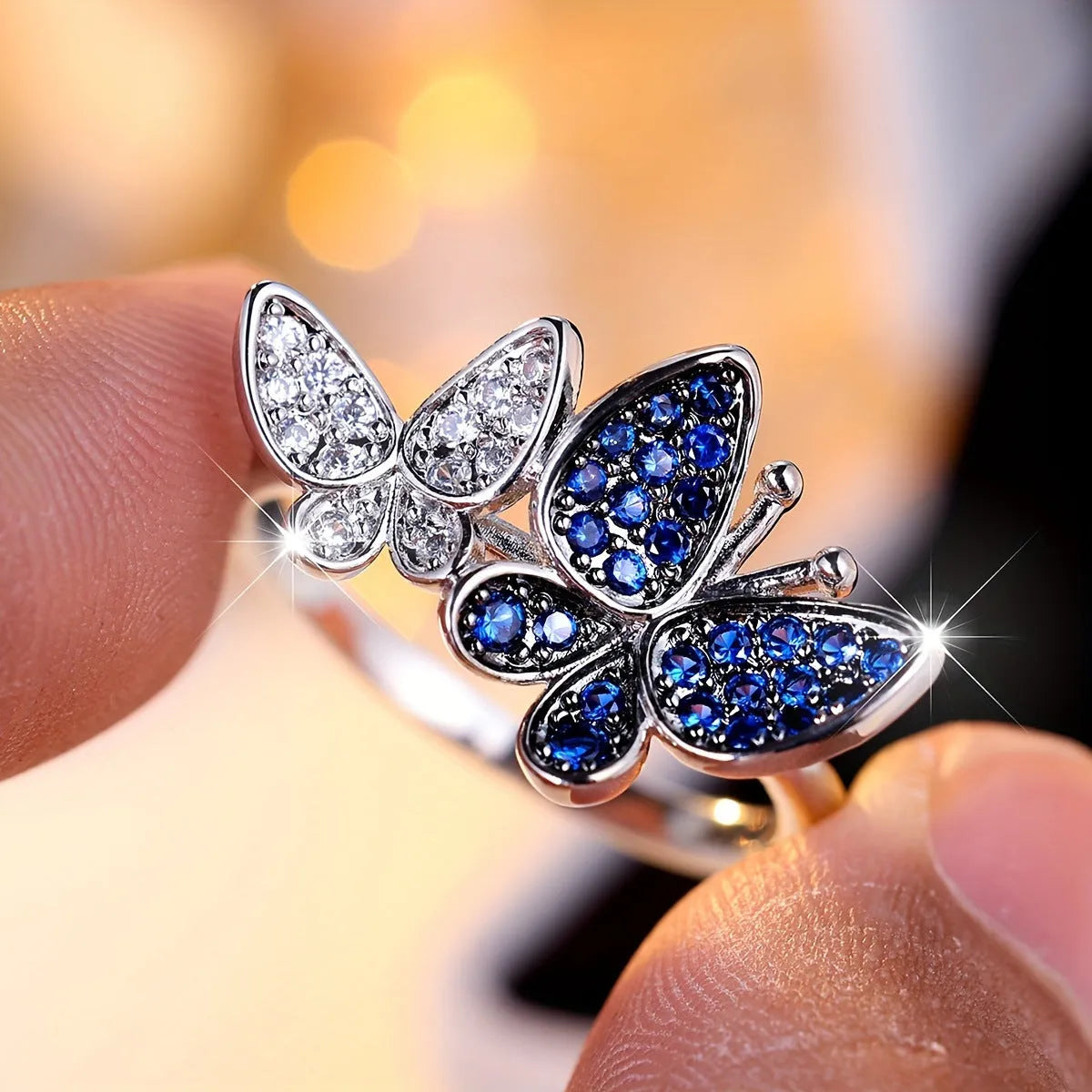 Blue and white butterfly design ring for women on a copper band, showing side detail.